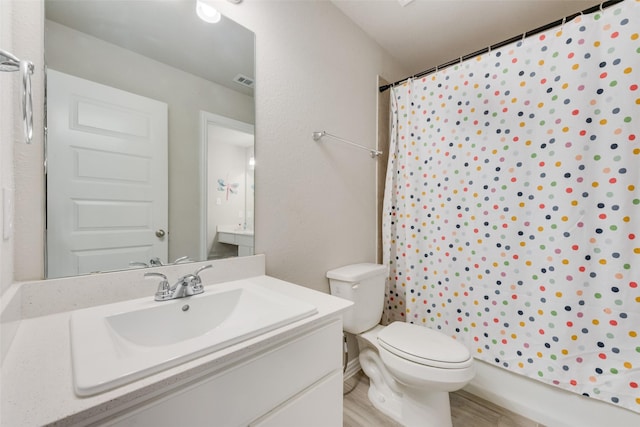 bathroom featuring hardwood / wood-style flooring, vanity, toilet, and a shower with shower curtain