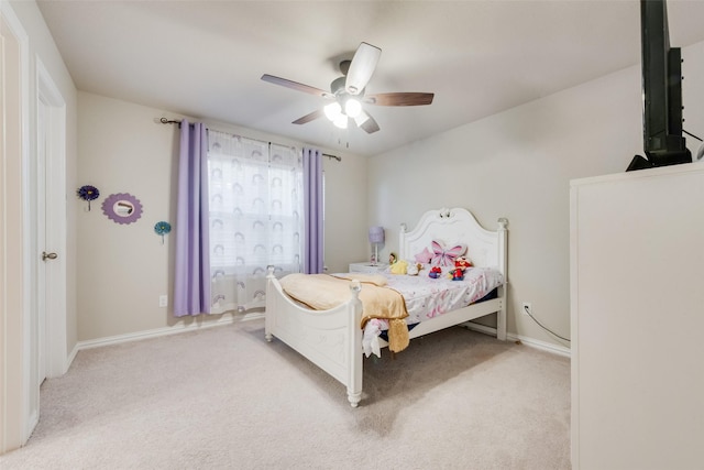 bedroom featuring light colored carpet and ceiling fan