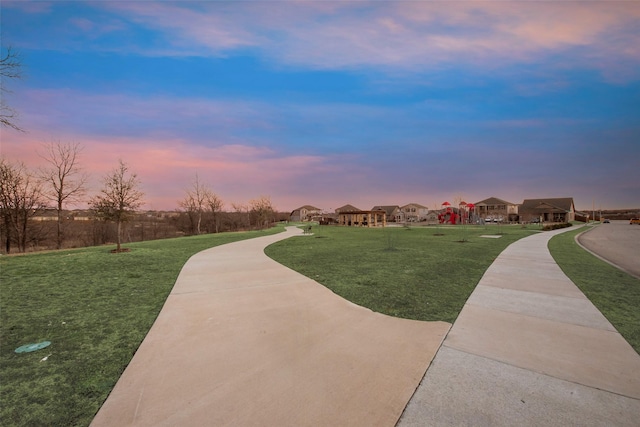 surrounding community featuring a lawn