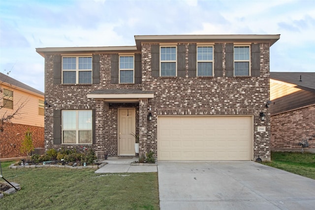 view of front of property with a garage and a front lawn