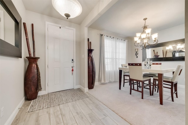 entryway featuring a chandelier