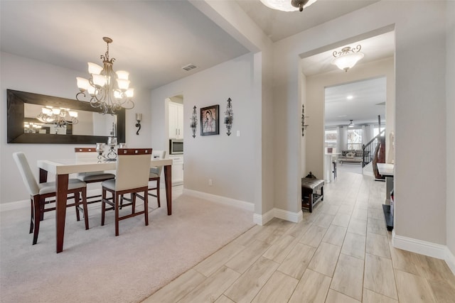 dining space with a notable chandelier