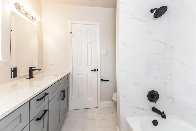 full bathroom with vanity, toilet, and tiled shower / bath