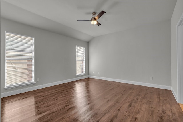 spare room featuring vaulted ceiling, ceiling fan, and hardwood / wood-style floors