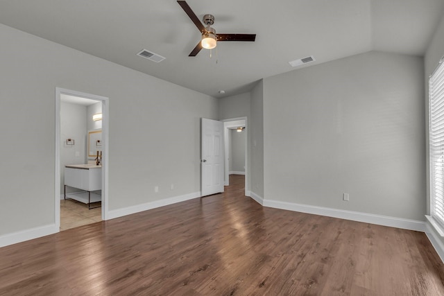 unfurnished bedroom featuring multiple windows, vaulted ceiling, ceiling fan, and light hardwood / wood-style floors