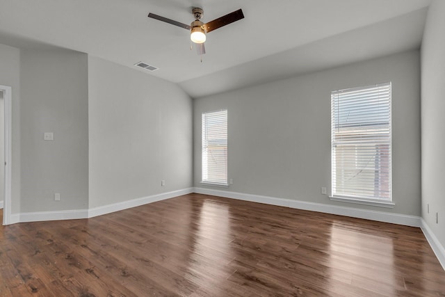 unfurnished room with vaulted ceiling, dark hardwood / wood-style floors, and ceiling fan