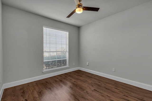 unfurnished room featuring ceiling fan and dark hardwood / wood-style flooring