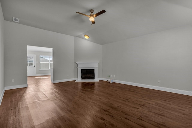 unfurnished living room with dark hardwood / wood-style flooring, lofted ceiling, and ceiling fan