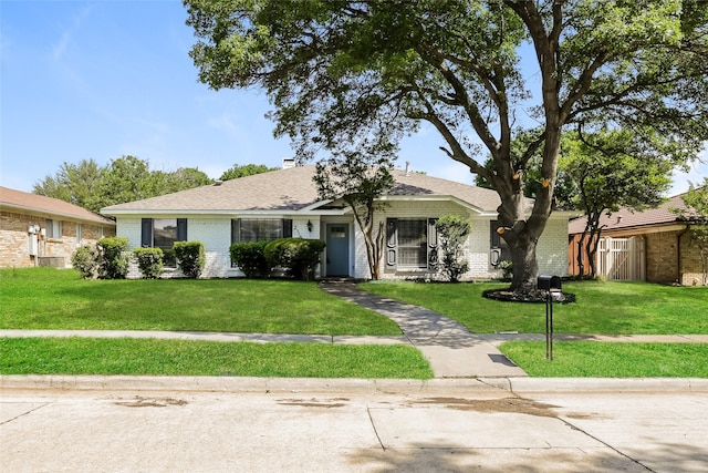 ranch-style house with a front yard