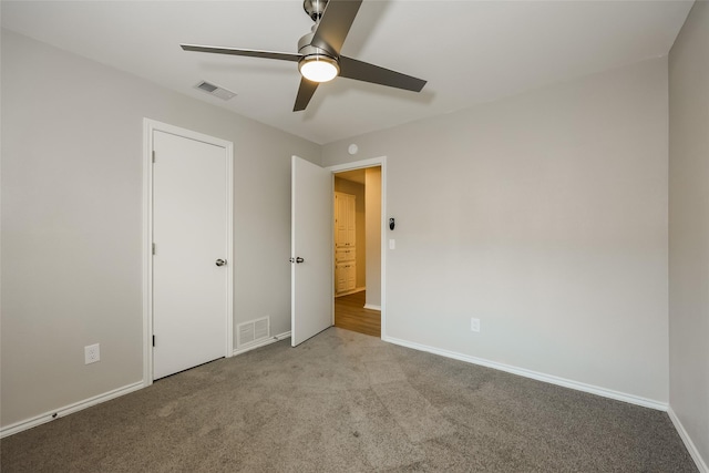 unfurnished bedroom featuring ceiling fan and light carpet