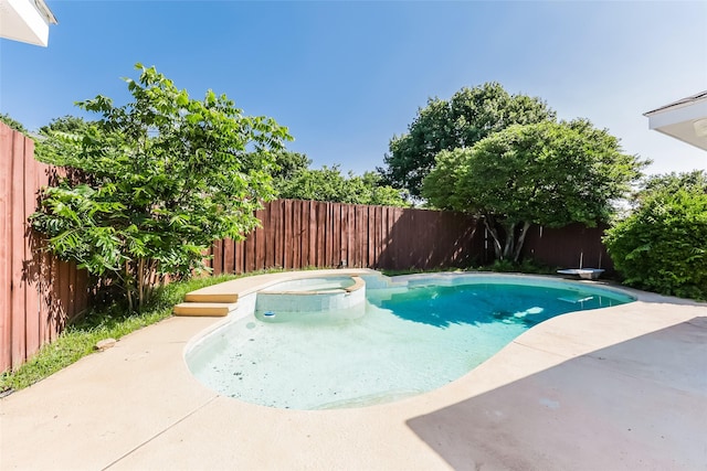 view of pool featuring a patio area, a diving board, and an in ground hot tub