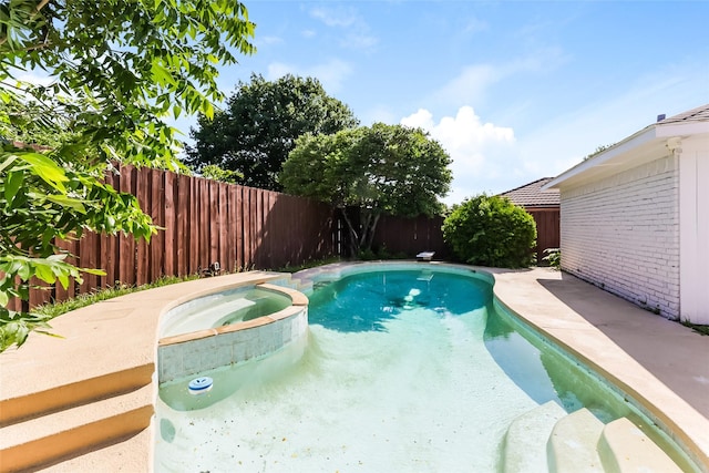 view of pool featuring an in ground hot tub and a patio area