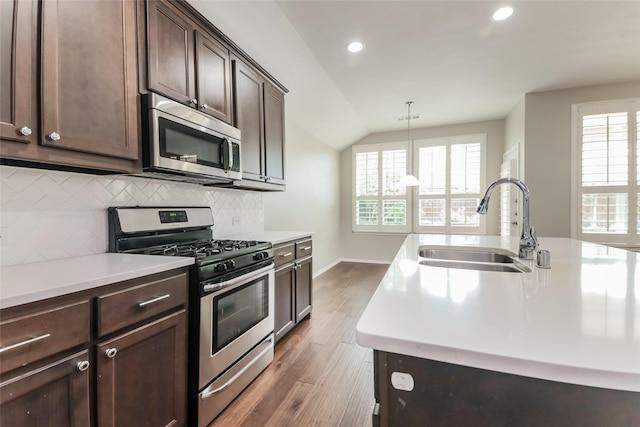 kitchen featuring pendant lighting, sink, plenty of natural light, and appliances with stainless steel finishes