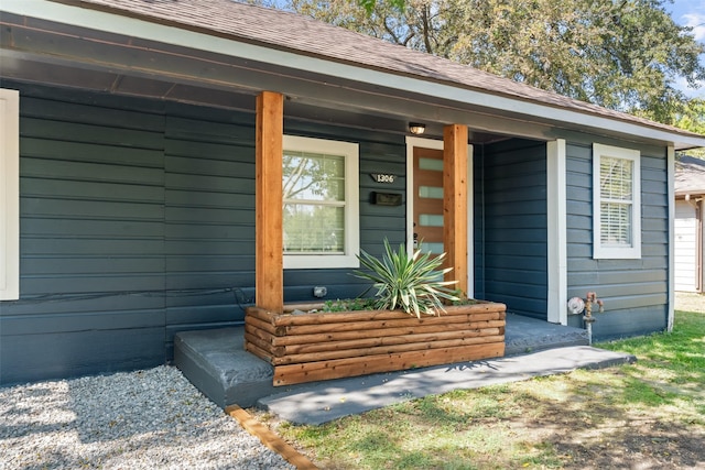 property entrance featuring covered porch