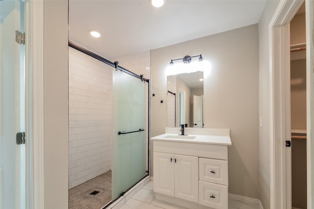 bathroom with vanity and a shower with shower door