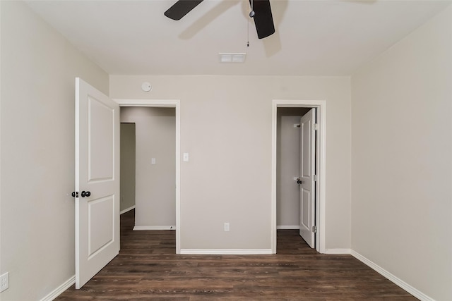 unfurnished bedroom with ceiling fan and dark hardwood / wood-style floors