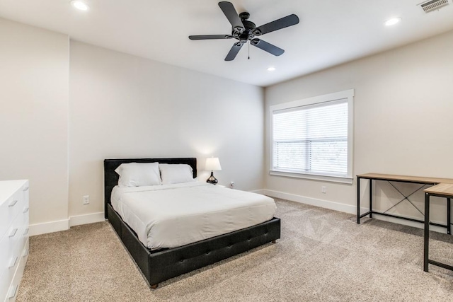 bedroom featuring light carpet and ceiling fan