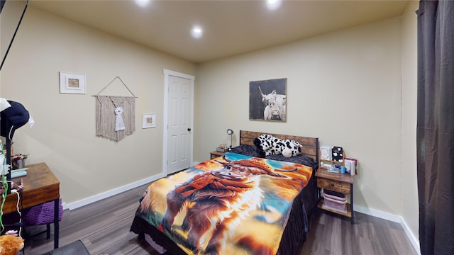 bedroom featuring dark hardwood / wood-style flooring