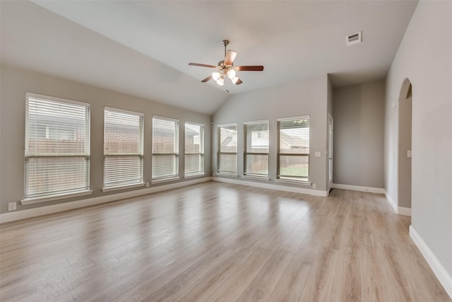 spare room featuring lofted ceiling, ceiling fan, and light hardwood / wood-style flooring