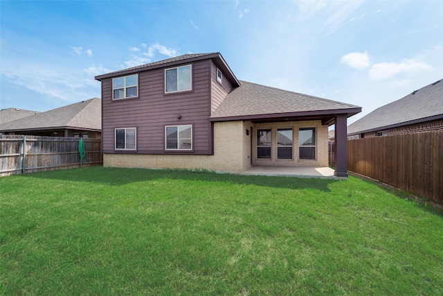 rear view of property with a patio area and a lawn