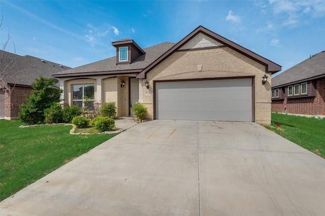 view of front of home with a garage and a front yard