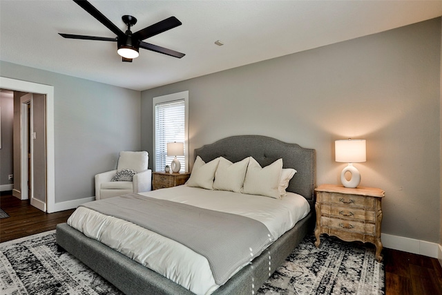 bedroom with ceiling fan and dark hardwood / wood-style flooring