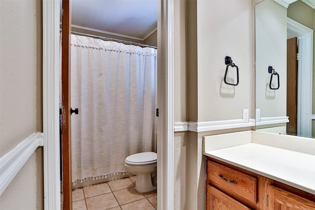 bathroom with vanity, walk in shower, tile patterned floors, and toilet