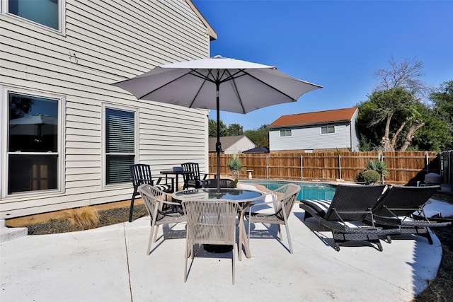 view of patio featuring a fenced in pool