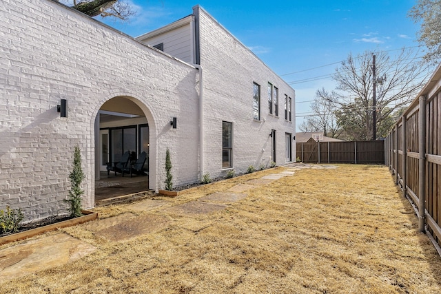 view of side of property featuring a patio area