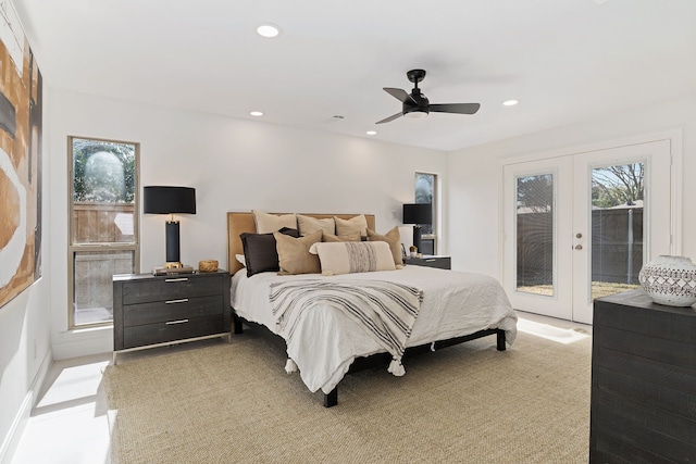 bedroom featuring multiple windows, access to outside, ceiling fan, and french doors