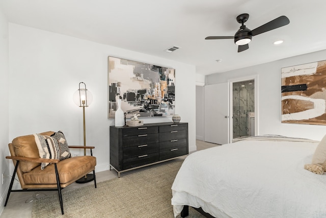 bedroom featuring ensuite bathroom, carpet floors, and ceiling fan