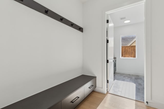 mudroom with light hardwood / wood-style floors