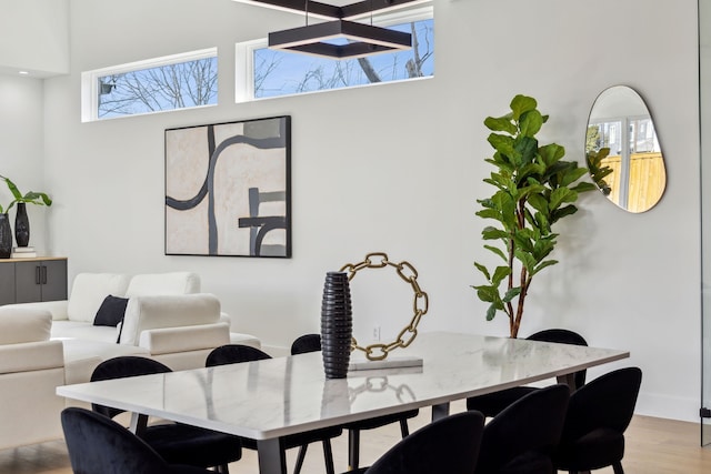 dining area featuring plenty of natural light and light wood-type flooring