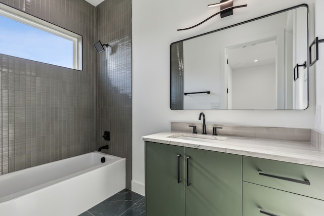 bathroom with vanity and tiled shower / bath combo