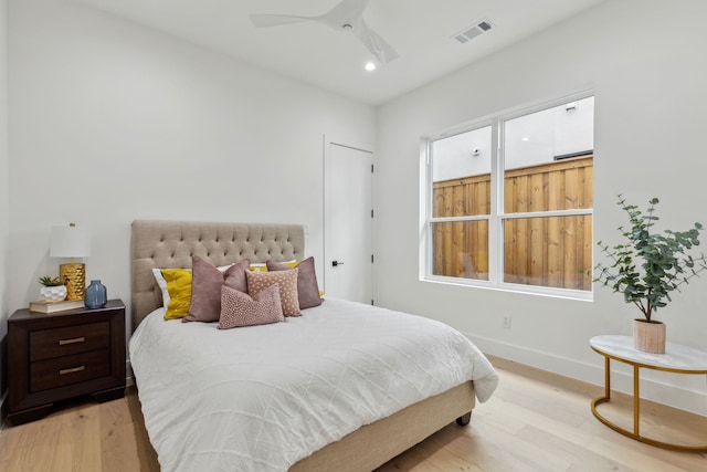 bedroom featuring ceiling fan and light hardwood / wood-style floors