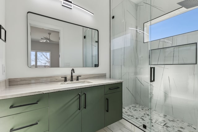 bathroom featuring vanity and an enclosed shower