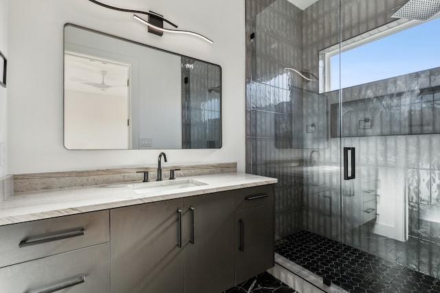 bathroom featuring vanity and a shower with shower door