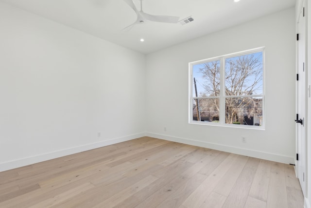 unfurnished room featuring ceiling fan and light wood-type flooring