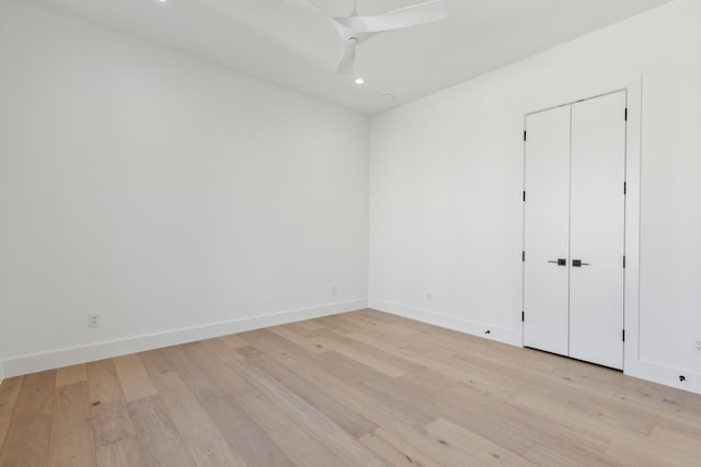 unfurnished room featuring ceiling fan and light hardwood / wood-style floors