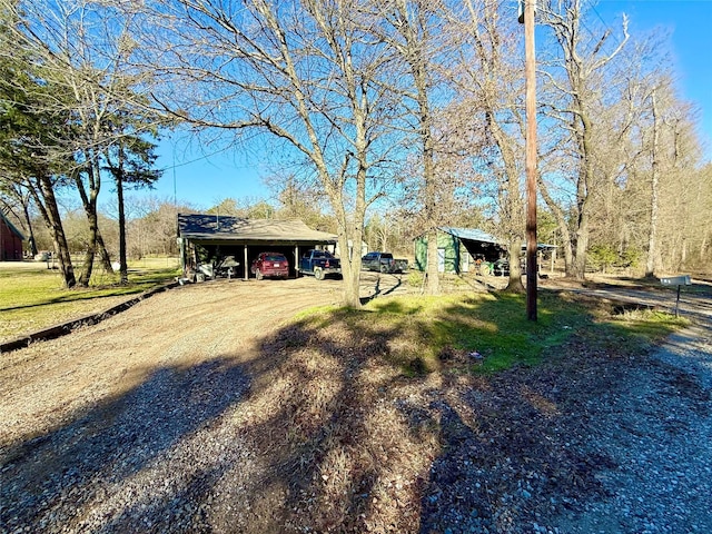 view of yard featuring a carport