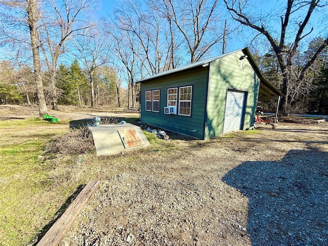 exterior space featuring cooling unit and an outdoor structure