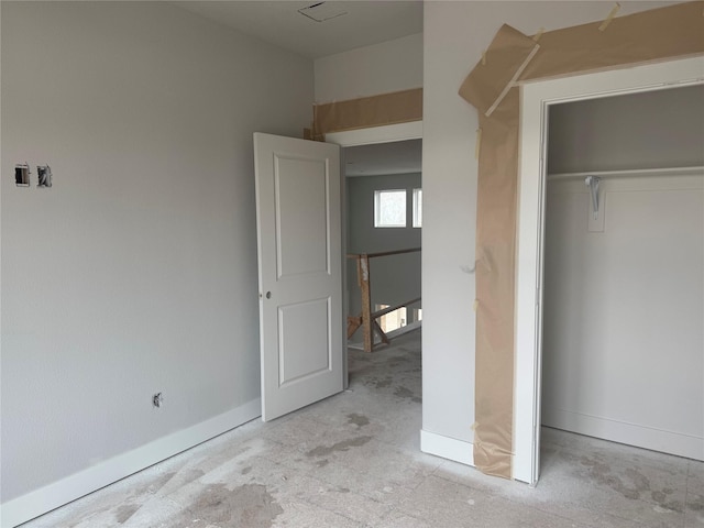 unfurnished bedroom with a closet