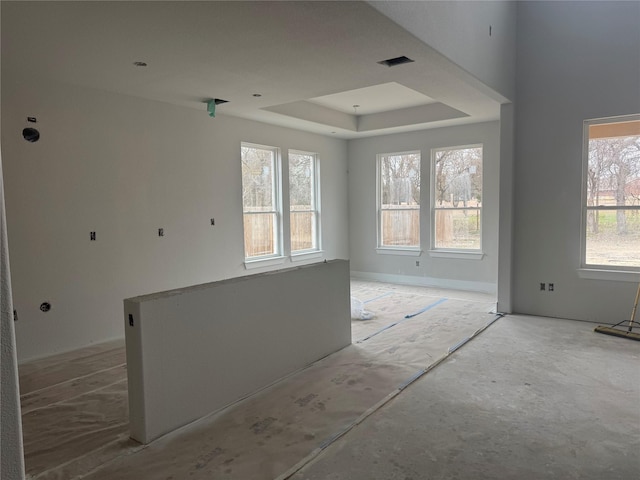 spare room with a tray ceiling