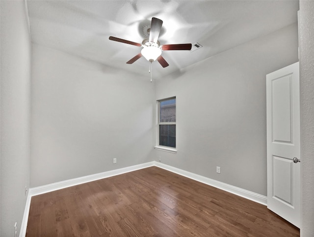 unfurnished room featuring ceiling fan and dark hardwood / wood-style flooring