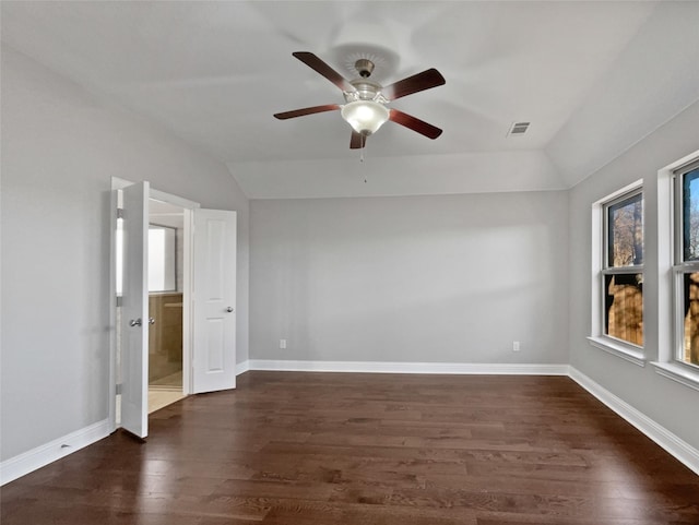 unfurnished room featuring ceiling fan, lofted ceiling, and dark hardwood / wood-style flooring