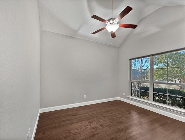 unfurnished room featuring vaulted ceiling, dark hardwood / wood-style floors, and ceiling fan