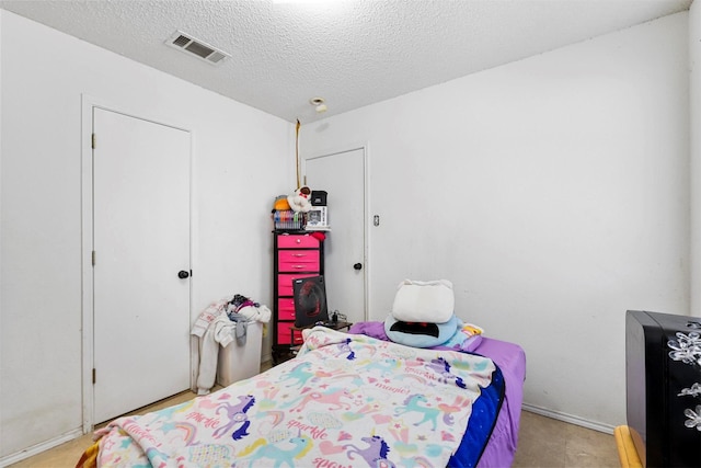 bedroom with a textured ceiling