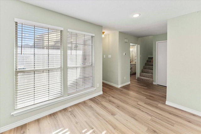 spare room with light wood-type flooring