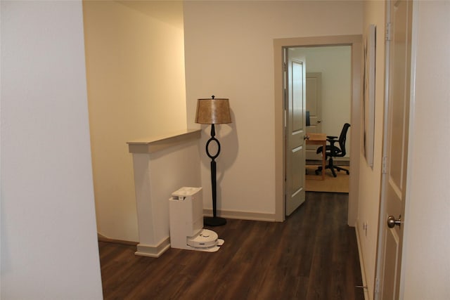 corridor featuring dark hardwood / wood-style flooring