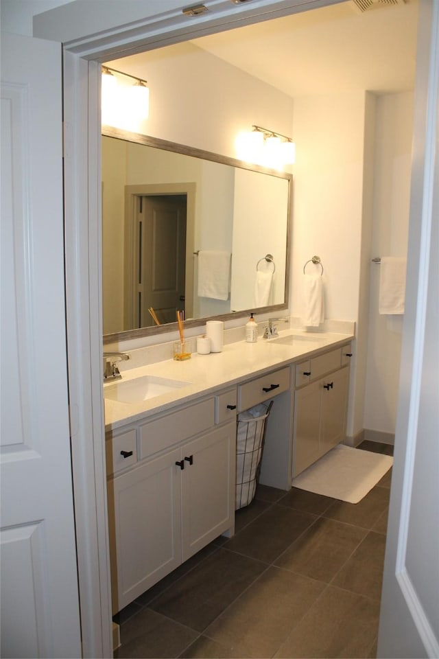 bathroom with vanity and tile patterned floors